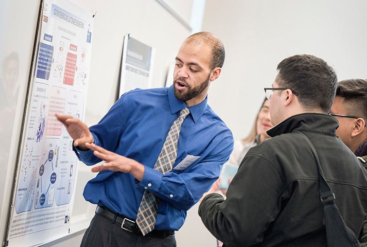 A student presents his research at the annual Zyzzogeton event